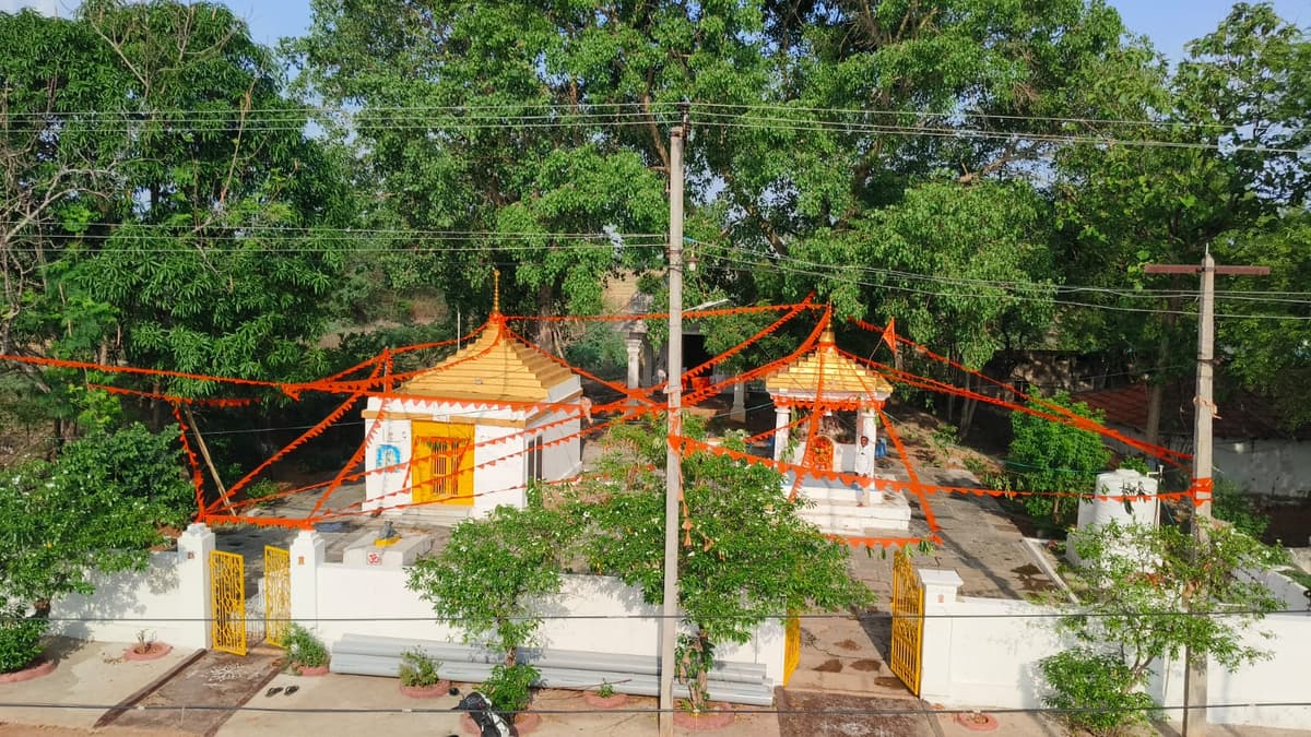 The temple decorated with saffron flags for the festival